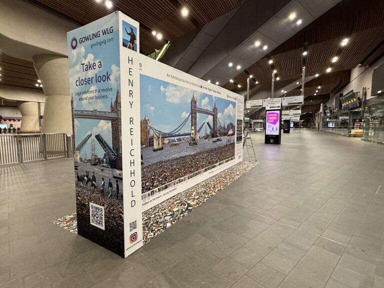 Henry Reichhold's Lost and Found stand in the London Bridge concourse, Tower Bridge montage facing out